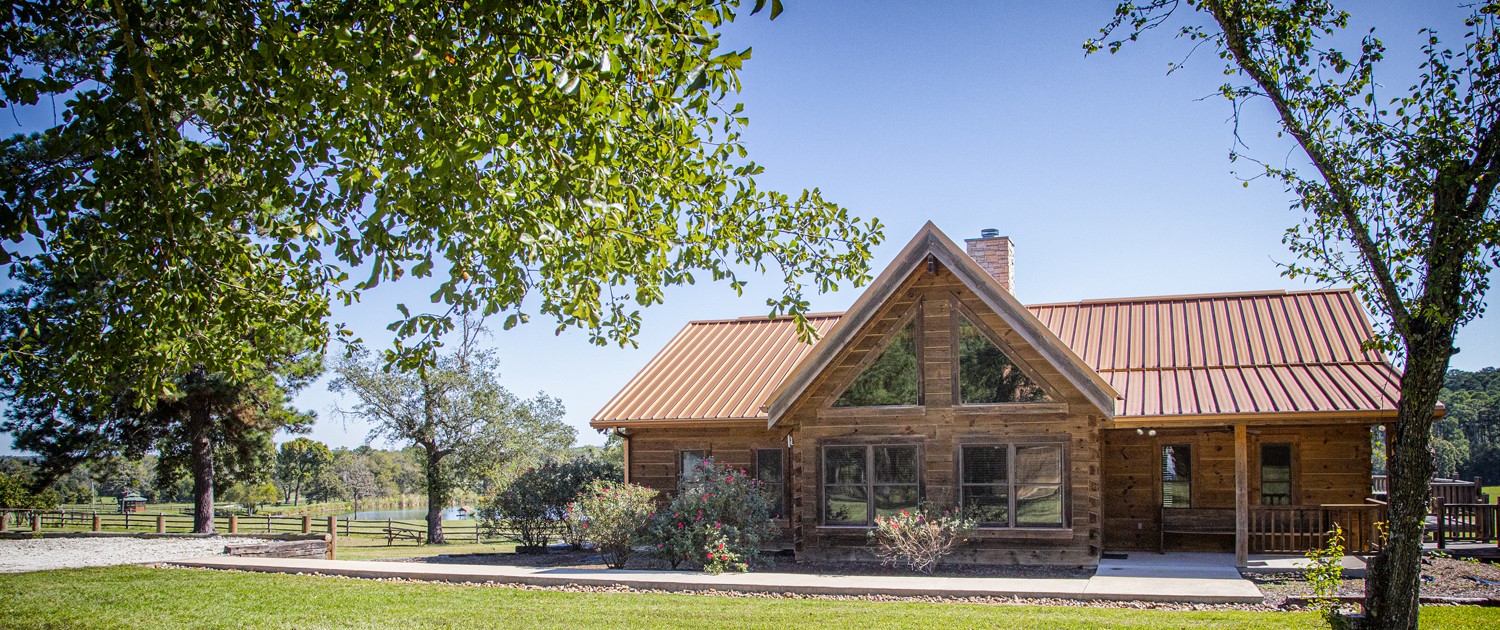 Beautiful view of West Sandy Creek Winery log cabin