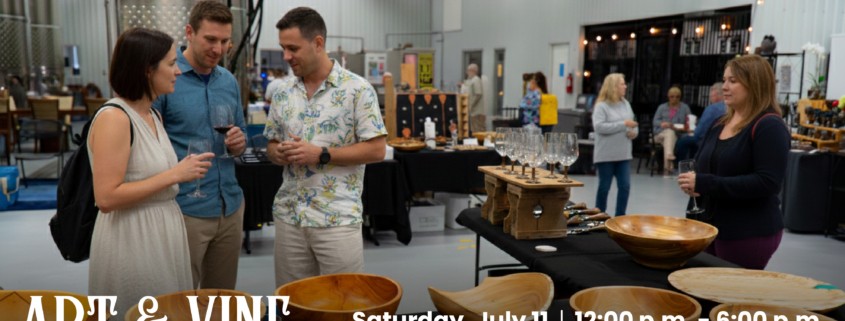 People mingle and drink wine at an indoor art market, browsing wooden bowls and handmade goods displayed on tables. Text overlay reads: “Art & Vine – A WSCW Art Market. Saturday, July 11 | 12:00 p.m. – 6:00 p.m. WSCW will host local artists for an indoor art market!”