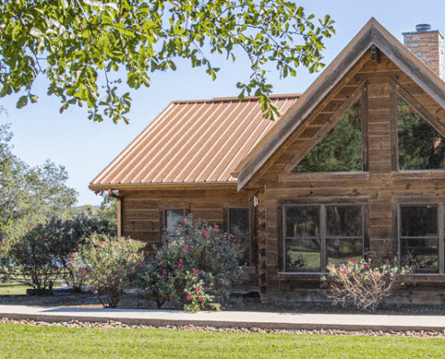 a landscape photo showing the cabins at WSC Winery in Texas on a sunny day